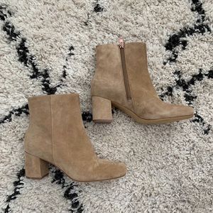 Cream colored ankle booties.